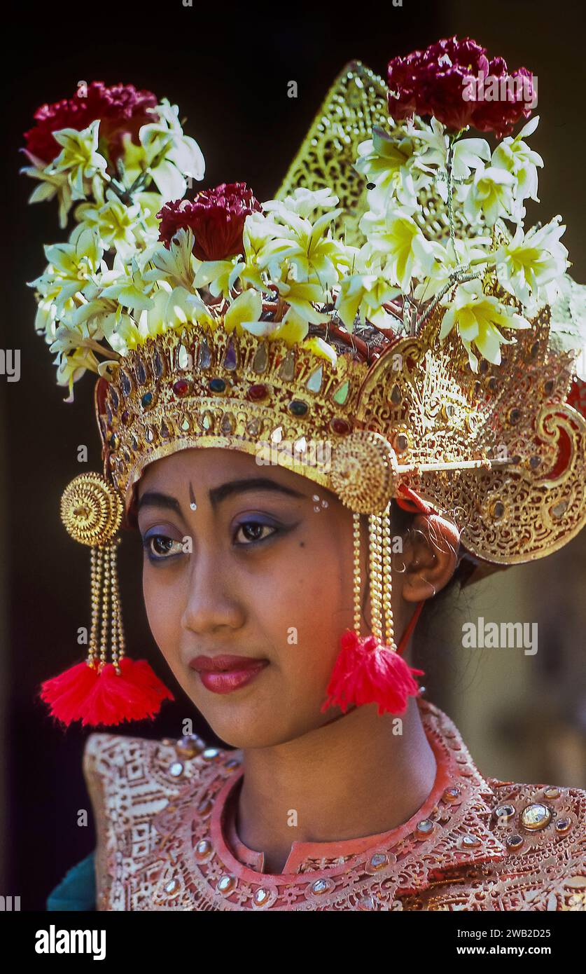 Indonesia, Bali.Portrait of temple dancer wearing traditional clothing. Stock Photo