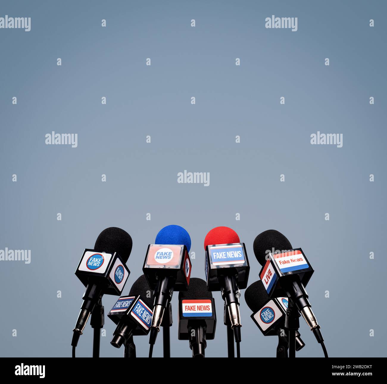 Microphones prepared for the press conference and mic flags displaying