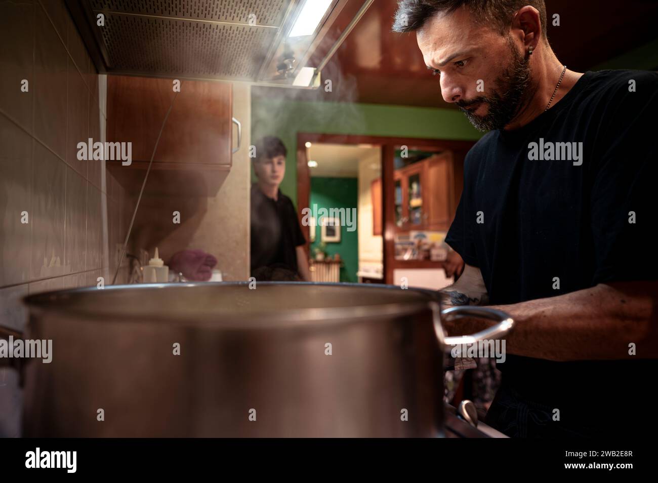 Cook working in a kitchen at a gastronomic event. Stock Photo