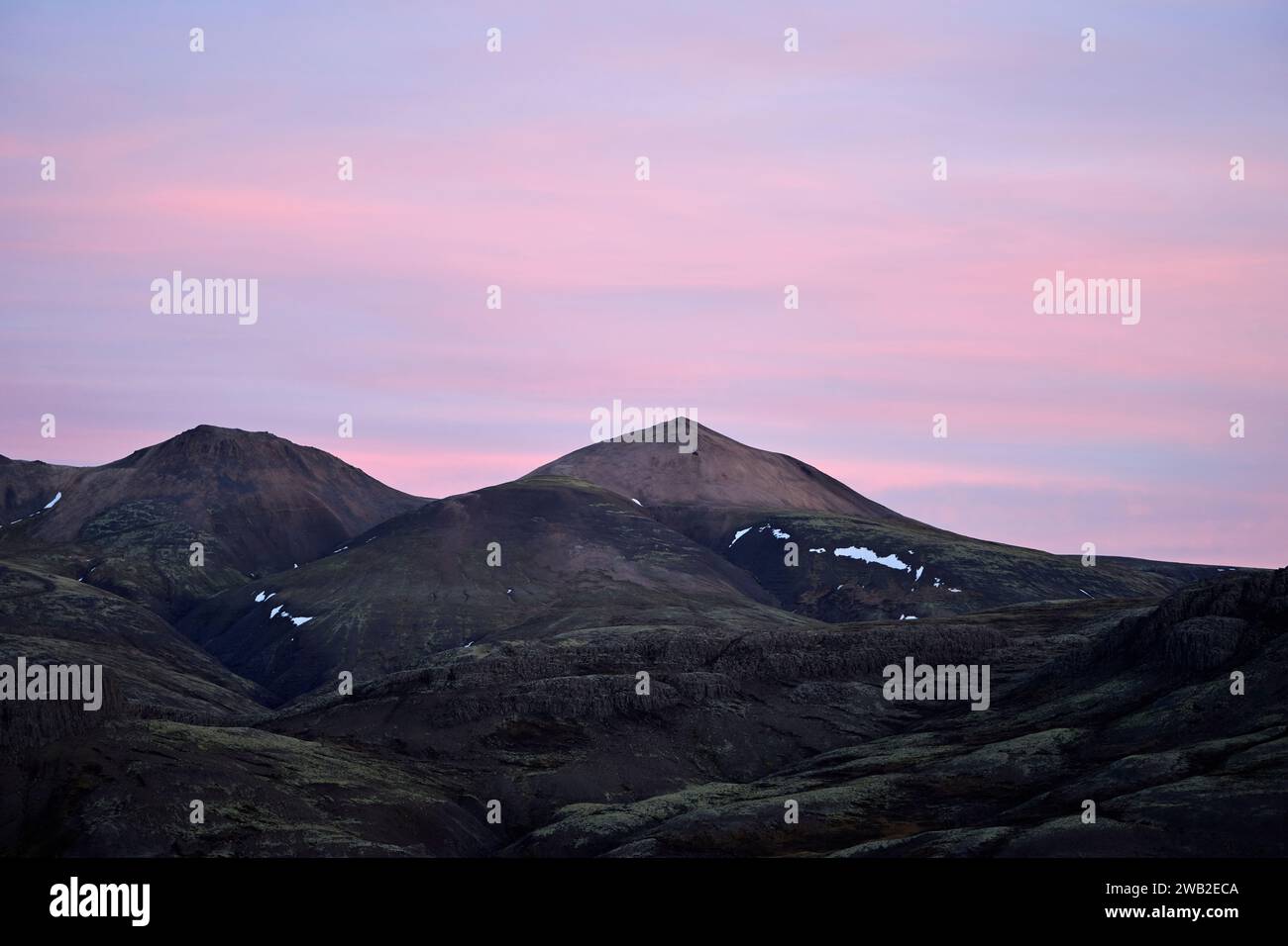 Rocky Mountains under sundown sky in nature Stock Photo
