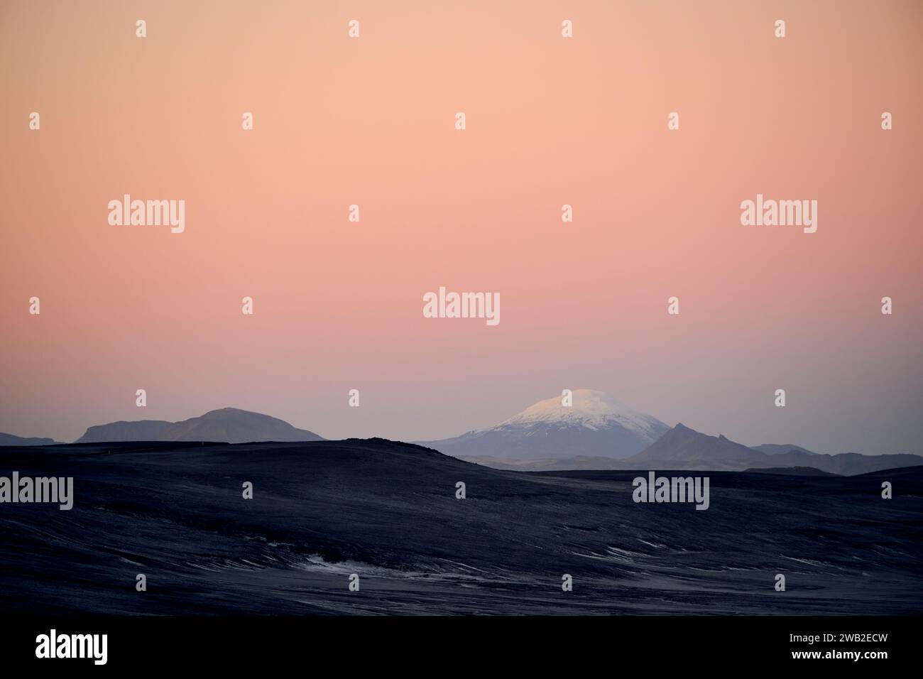 Mountains with snow against evening sky Stock Photo