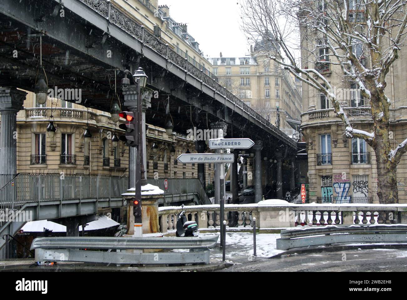Unexpected snow in Paris. Entrance to Bir Hakeim Bridge. Stock Photo