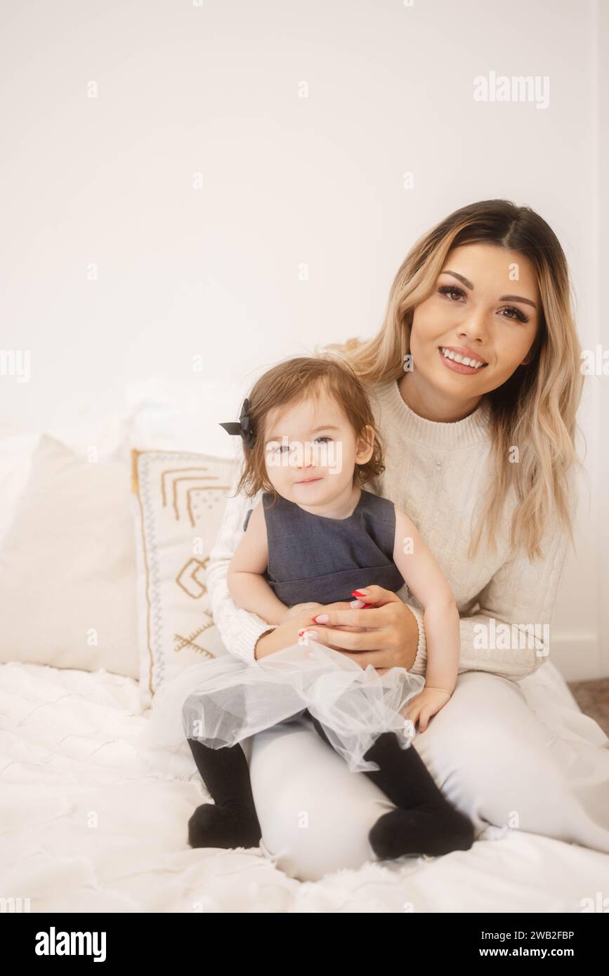 Happy Toddler Daughter and Mother Portrait on a Bed Stock Photo Alamy