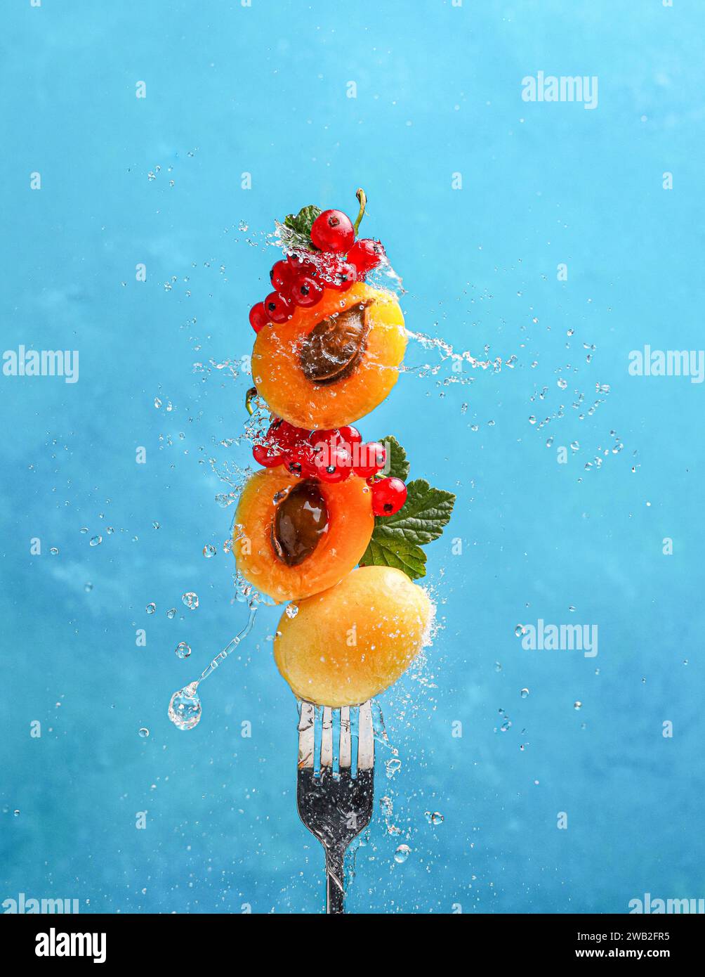 Fresh fruits with splash of water. Symbol freshness and vitality. Stock Photo