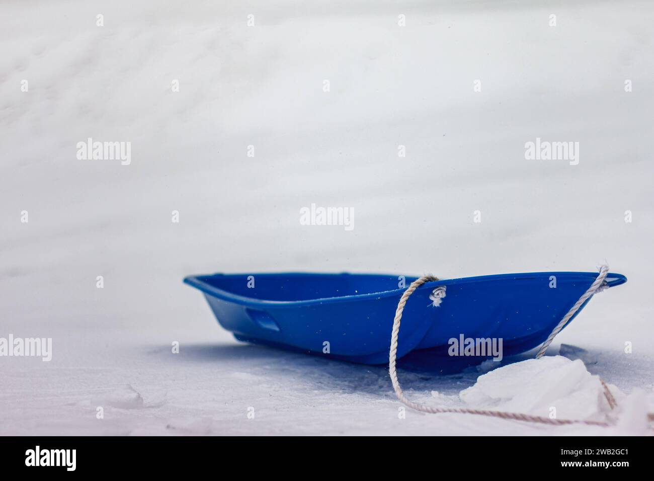 Photo of sled on snow in color Stock Photo Alamy