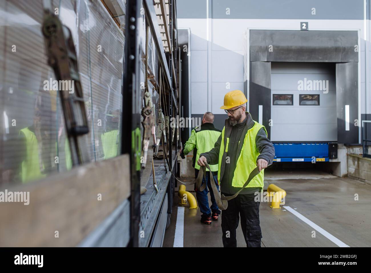 Warehouse receivers unloading of the truck in front of warehouse ...