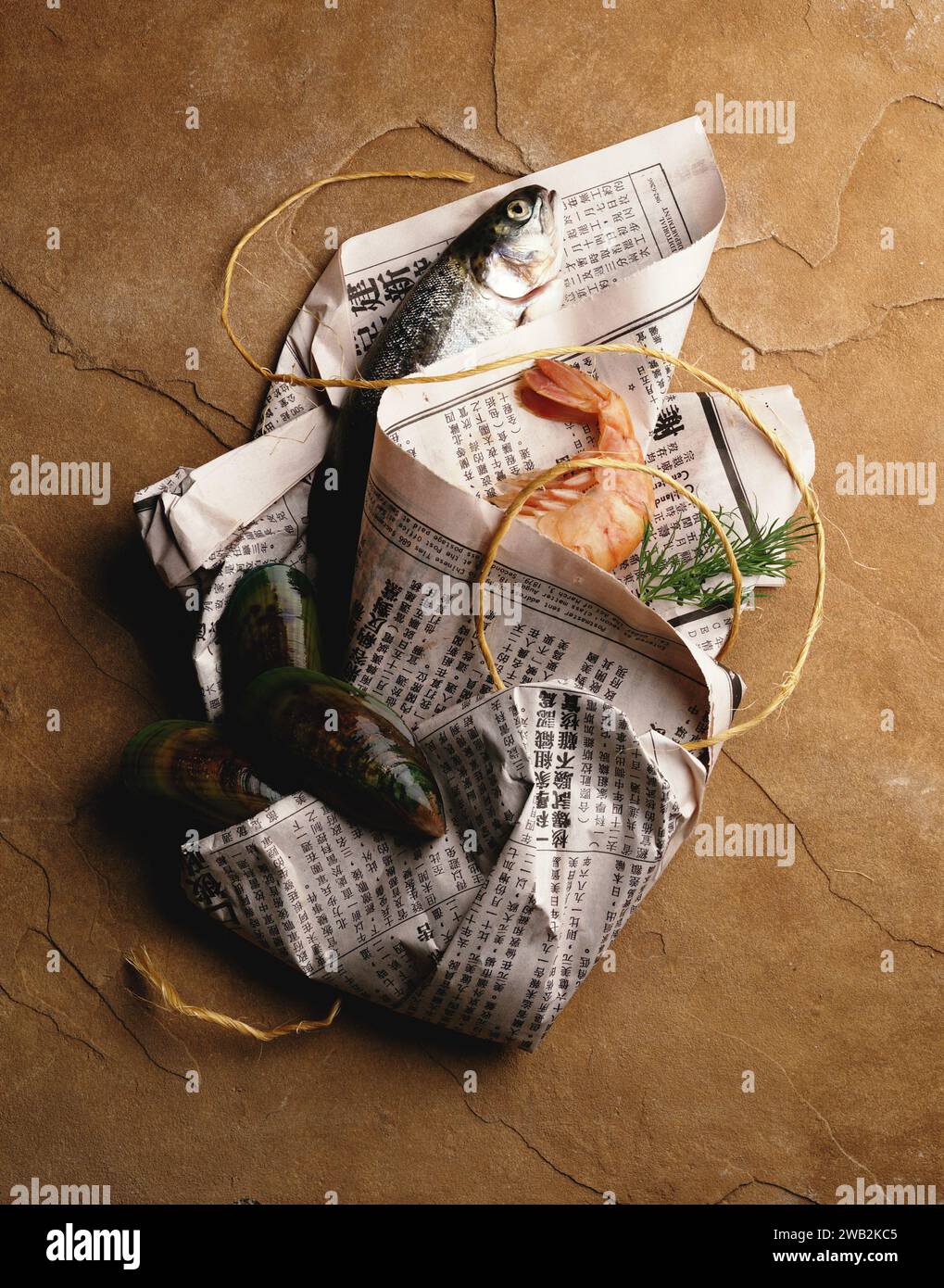Seafood wrapped with japanese newspaper hi-res stock photography and ...