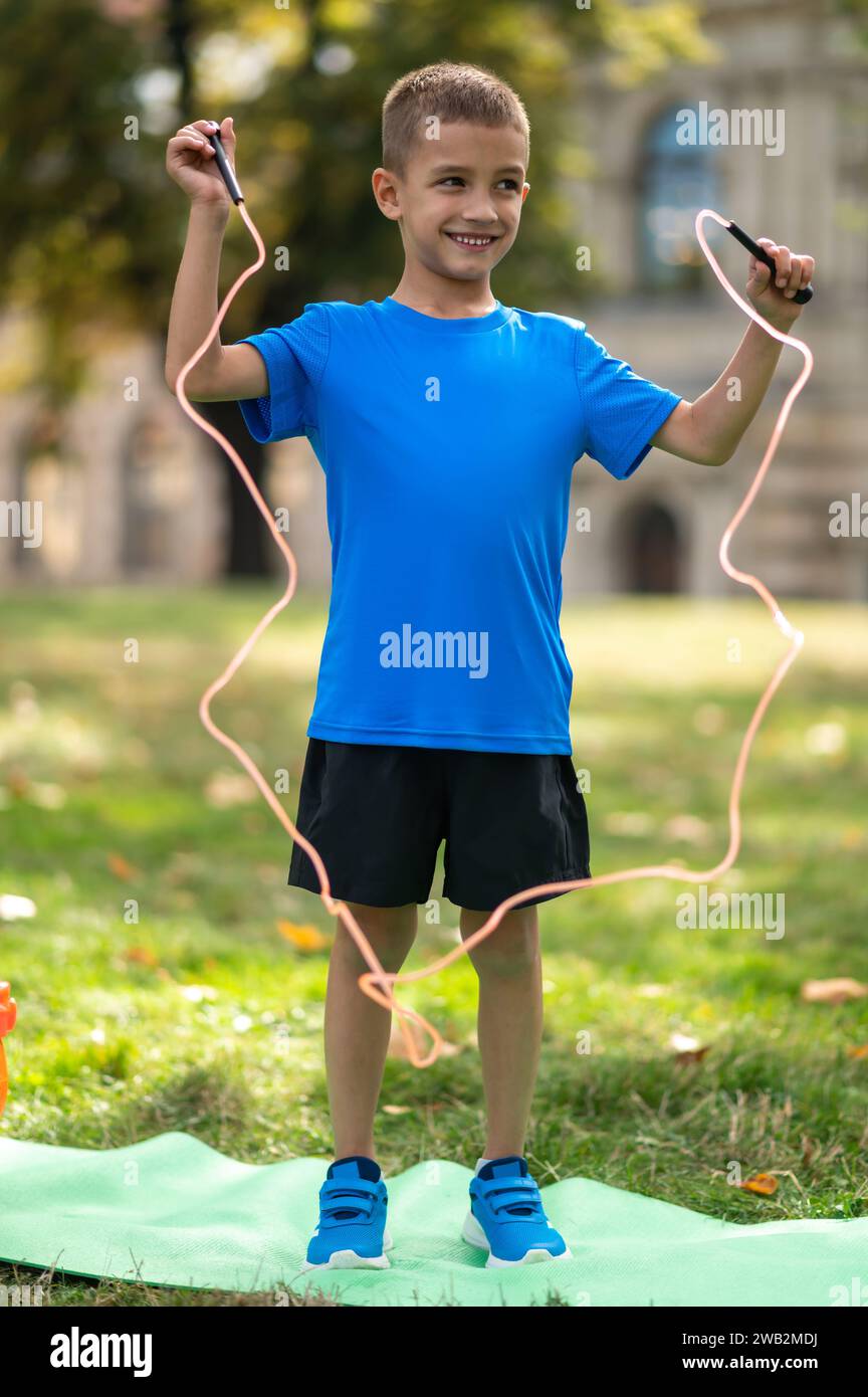 Boy Using A Rope Boy jumping a rope hi-res stock photography and images - Alamy