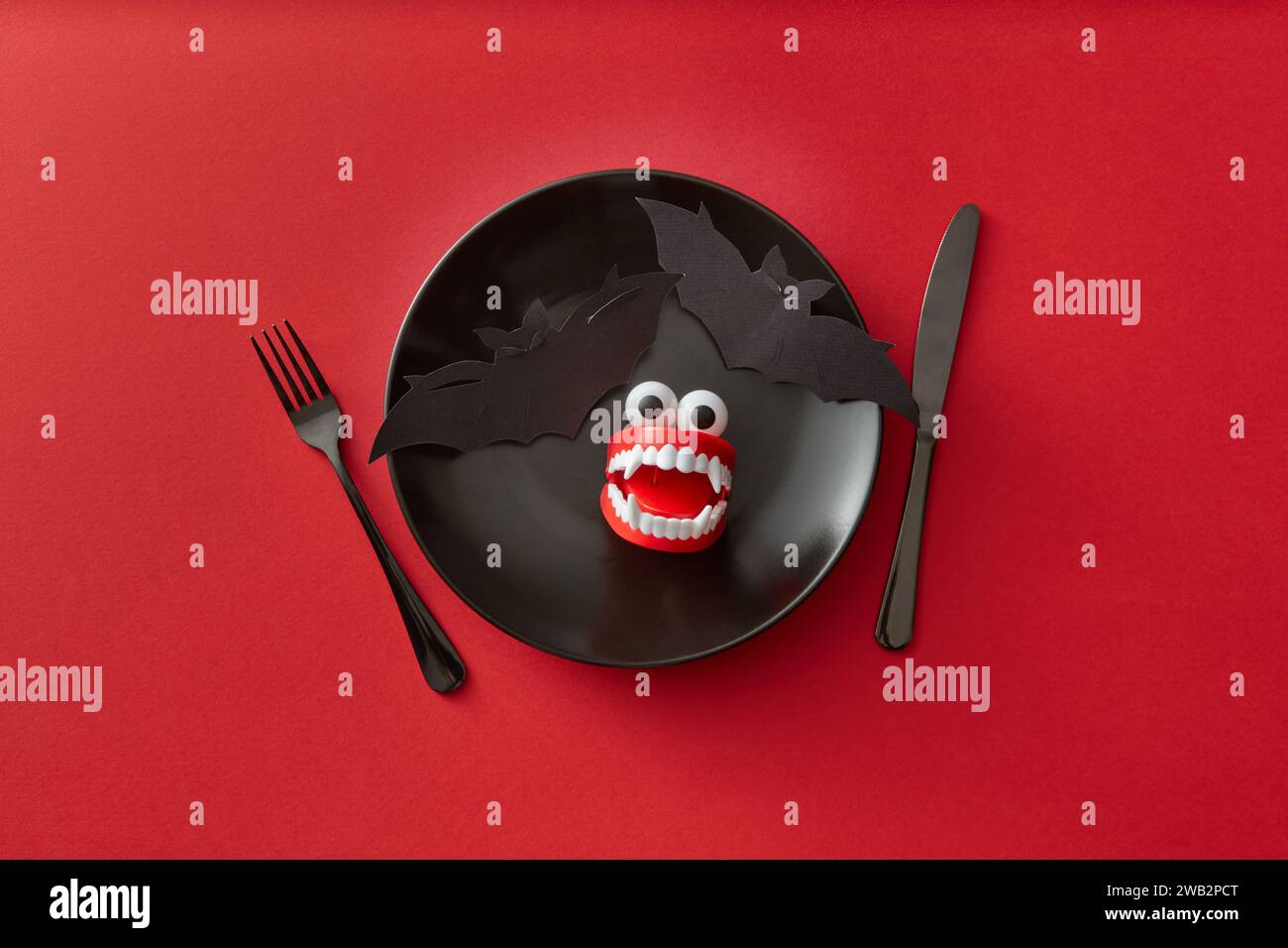 A Spooky and Festive Halloween Dinner Plate on red Stock Photo