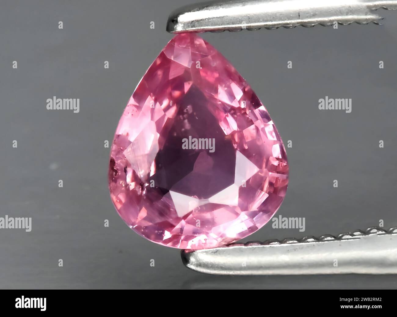 Natural pink sapphire gem on background Stock Photo