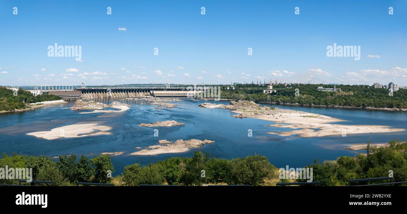 Panoramic view of the lower pool of the Dnieper Hydroelectric Power Plant and rocks during a strong low tide after the destruction of the Kakhovka dam Stock Photo