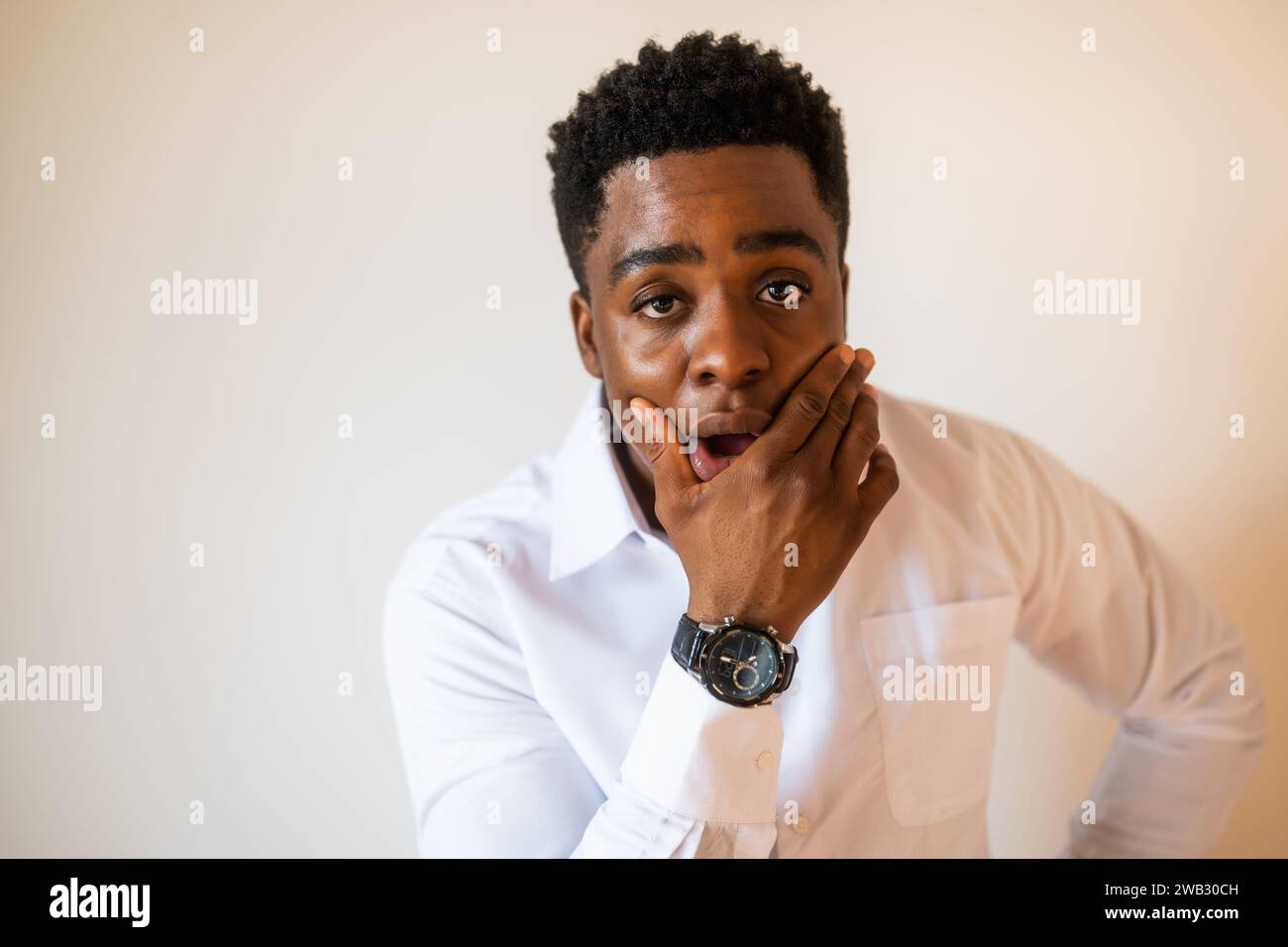 Portrait of young businessman who is shocked. Stock Photo