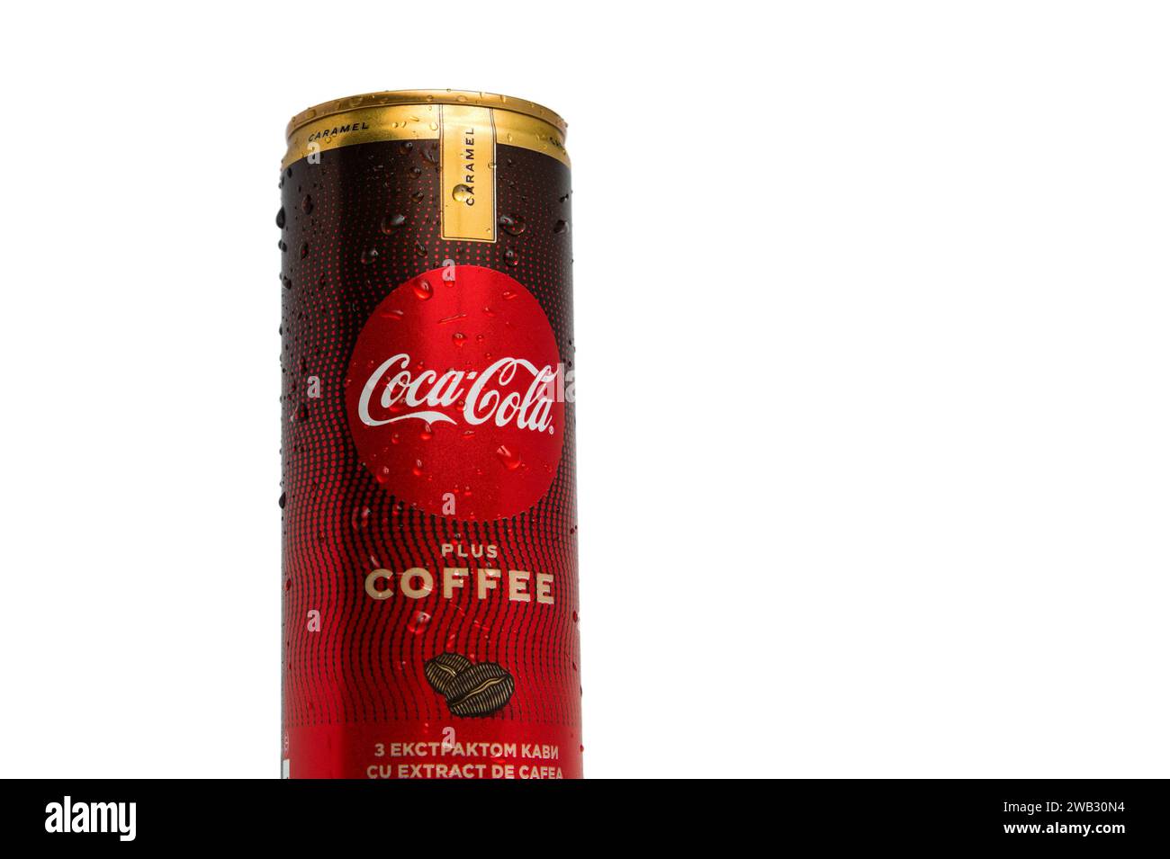 A can of Coca-Cola Plus Coffee Caramel with drops of water on a white background Stock Photo