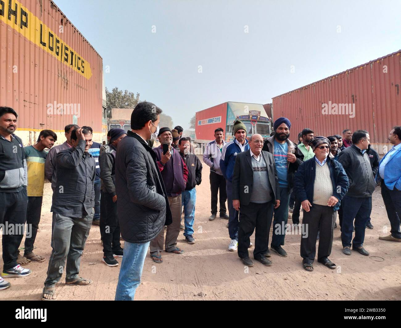 GURUGRAM, INDIA - JANUARY 2: Trucks parked in Transport Nagar during a strike against the new hit-and-run law of the Central government at sector-33 near Hero Honda Chowk, on January 2, 2024 in Gurugram, India. Commercial vehicle drivers on Monday staged massive protests in several states across the country against the new hit-and-run law that increases jail term for road accidents. Under the law, drivers of the vehicles could be jailed for upto 10 years for fleeing the accident site and not reporting it. In the earlier law, drivers could be jailed for only two years under IPC's Section 304A o Stock Photo