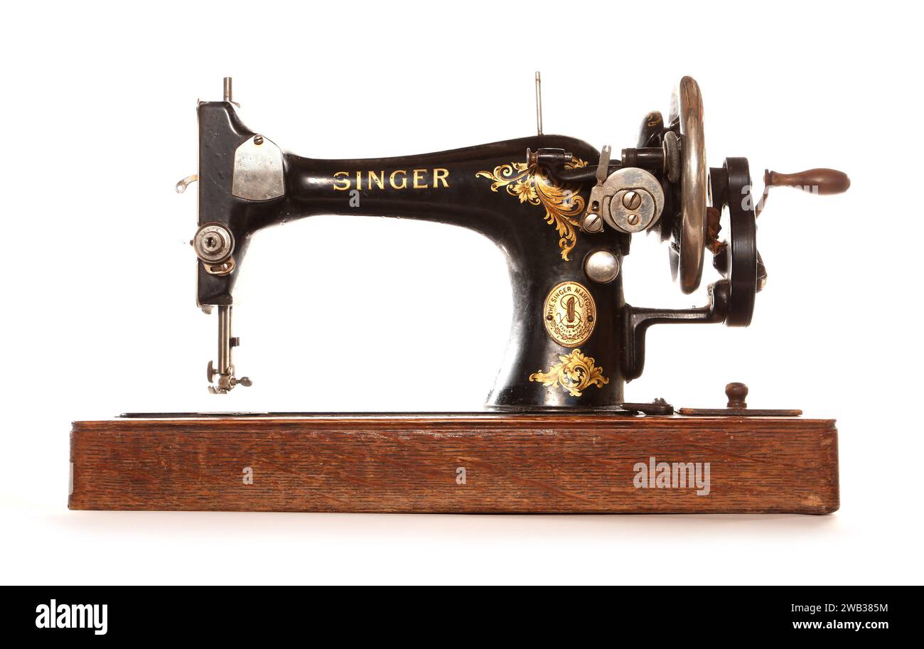 Vintage black Singer sewing machine isolated on white Stock Photo