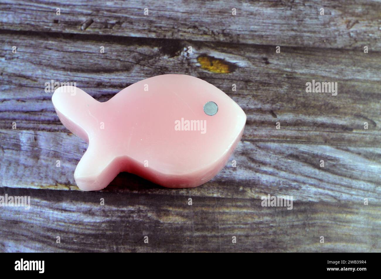 scented fish shaped candle, A candle is an ignitable wick embedded in