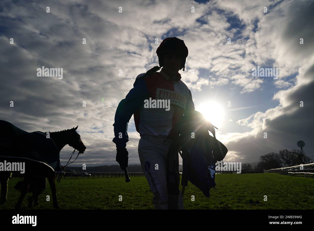 A jockey walks in after the Blackdown Motor Company Maiden Hurdle at