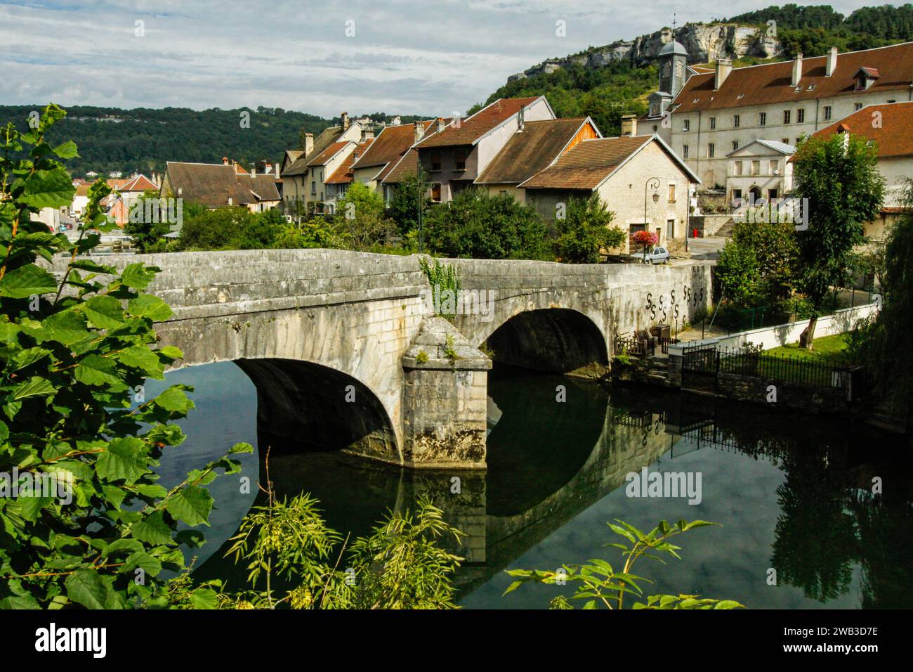 Bridge over the river in the city of Ornans in the valllée de la Loue, Doubs department, Bourgogne-Franche-Comté region, France Stock Photo