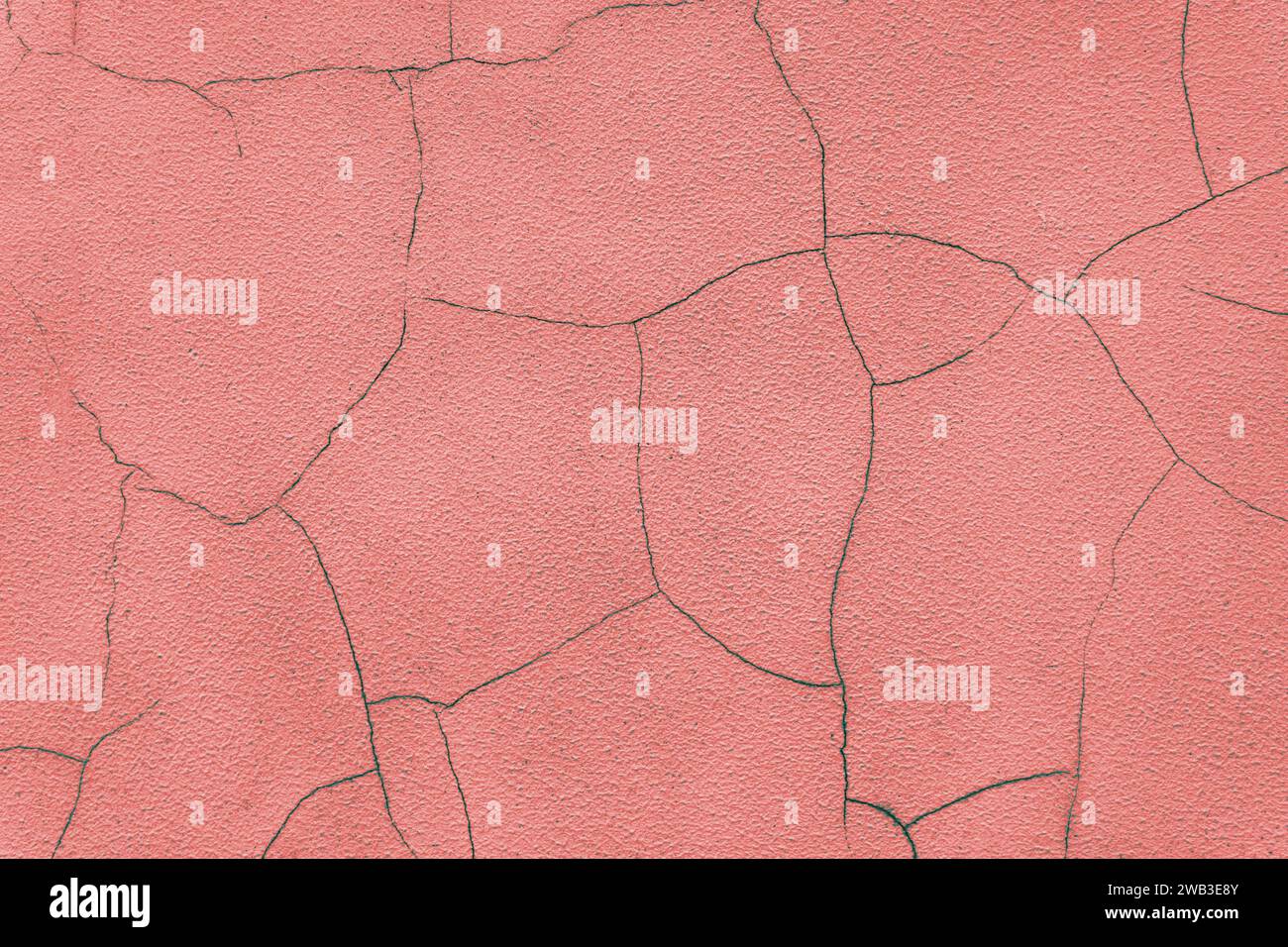 Old stucco plaster surface with cracks, close up grunge texture of red painted cement, concrete wall texture background. Wallpaper, backdrop, architec Stock Photo