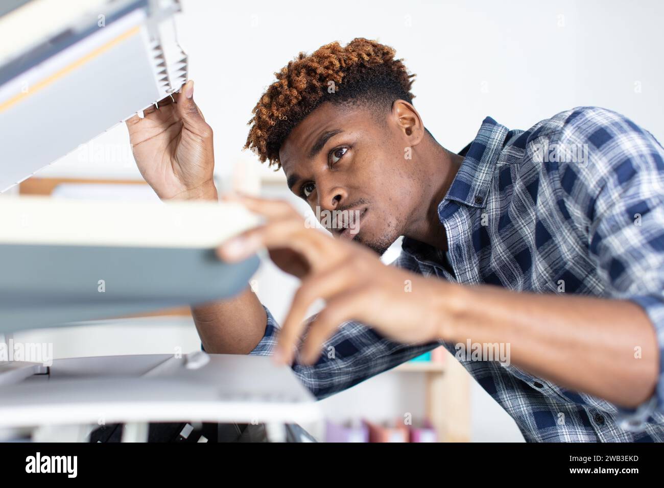 Office worker using fax machine hi-res stock photography and images - Alamy