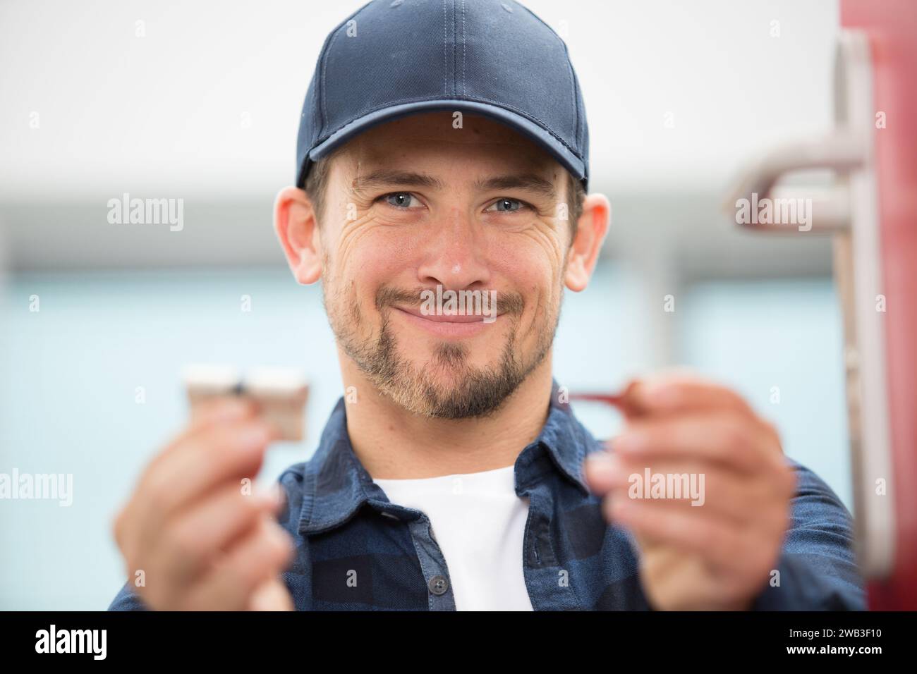 happy male worker smiling at the camera Stock Photo