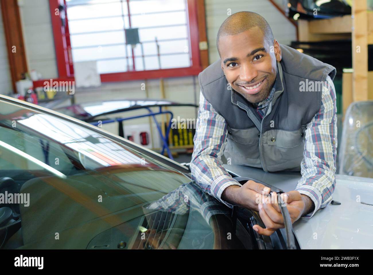 Leaning across hi-res stock photography and images - Alamy