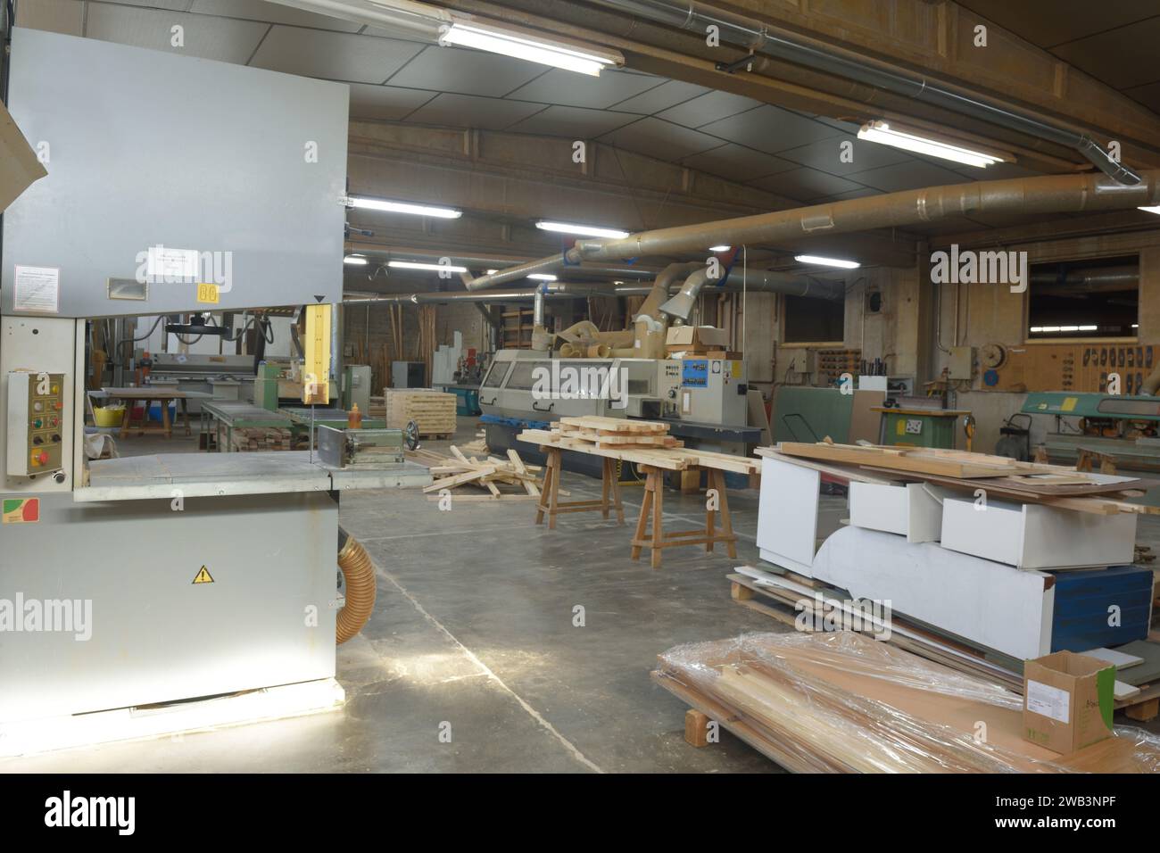 interior of a carpentry shop with a band saw Stock Photo