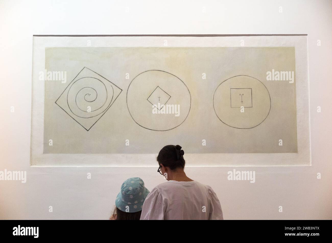 Mother & daughter visit to look at art. Pablo Picasso drawing, on display wall in Musée Picasso, formerly Château Grimaldi. Antibes. France. (135) Stock Photo