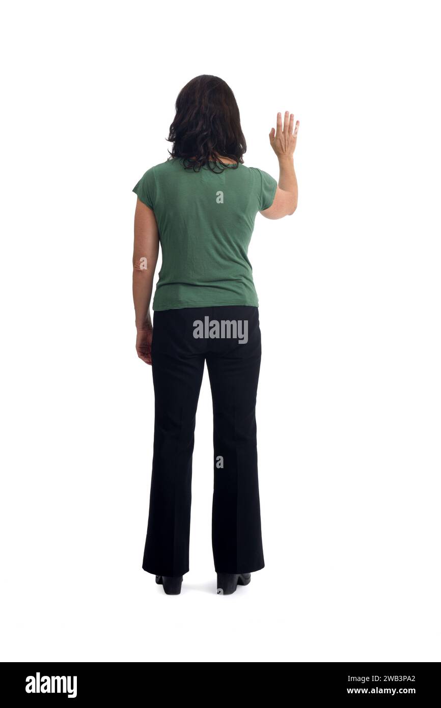 back view of a woman standing waving on white background Stock Photo
