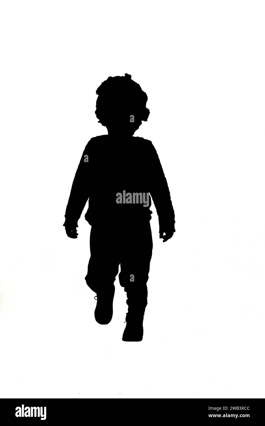 front view of silhouette a baby boy walking on white background Stock Photo