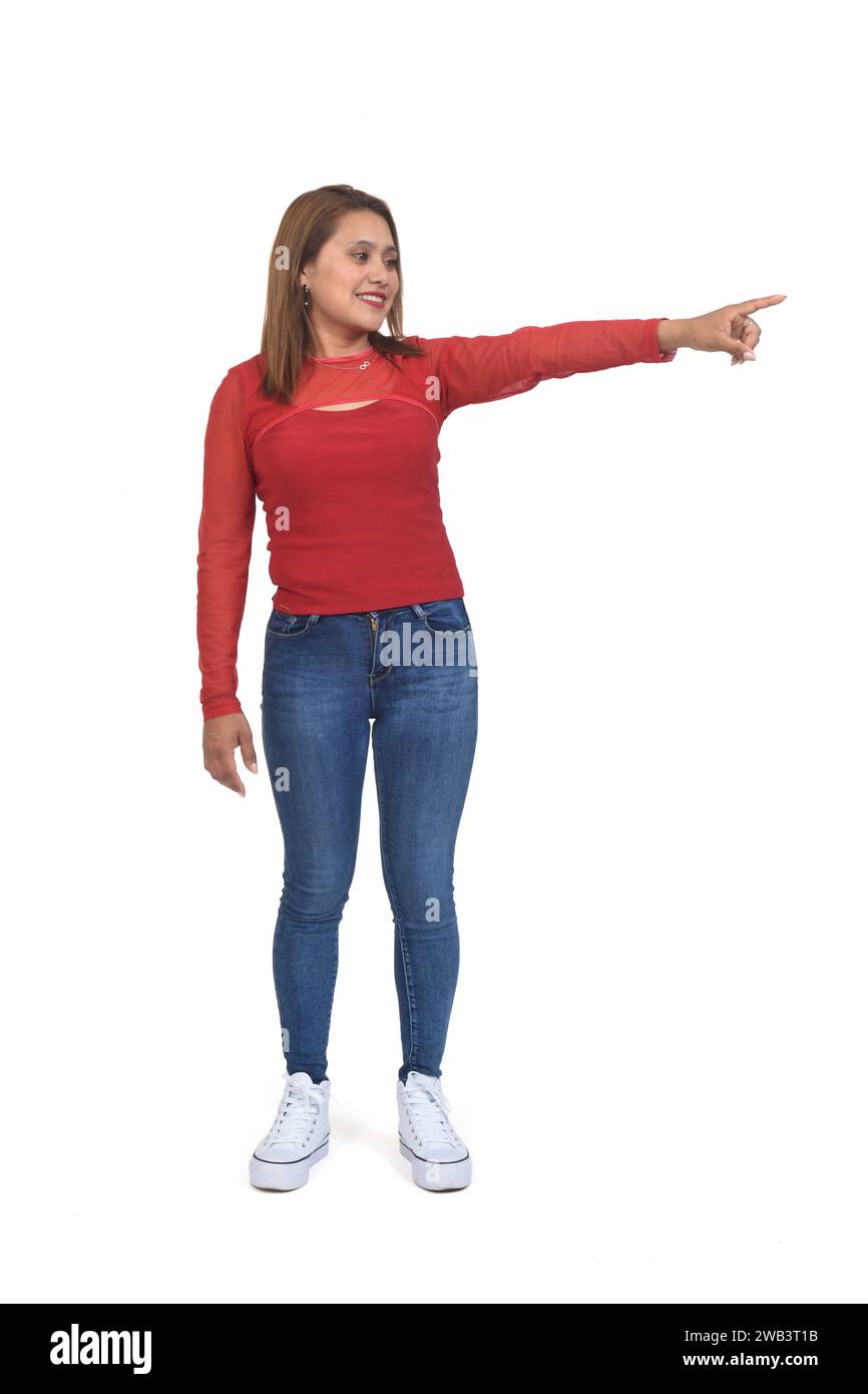 full portait of woman pointing to the side on white background Stock Photo