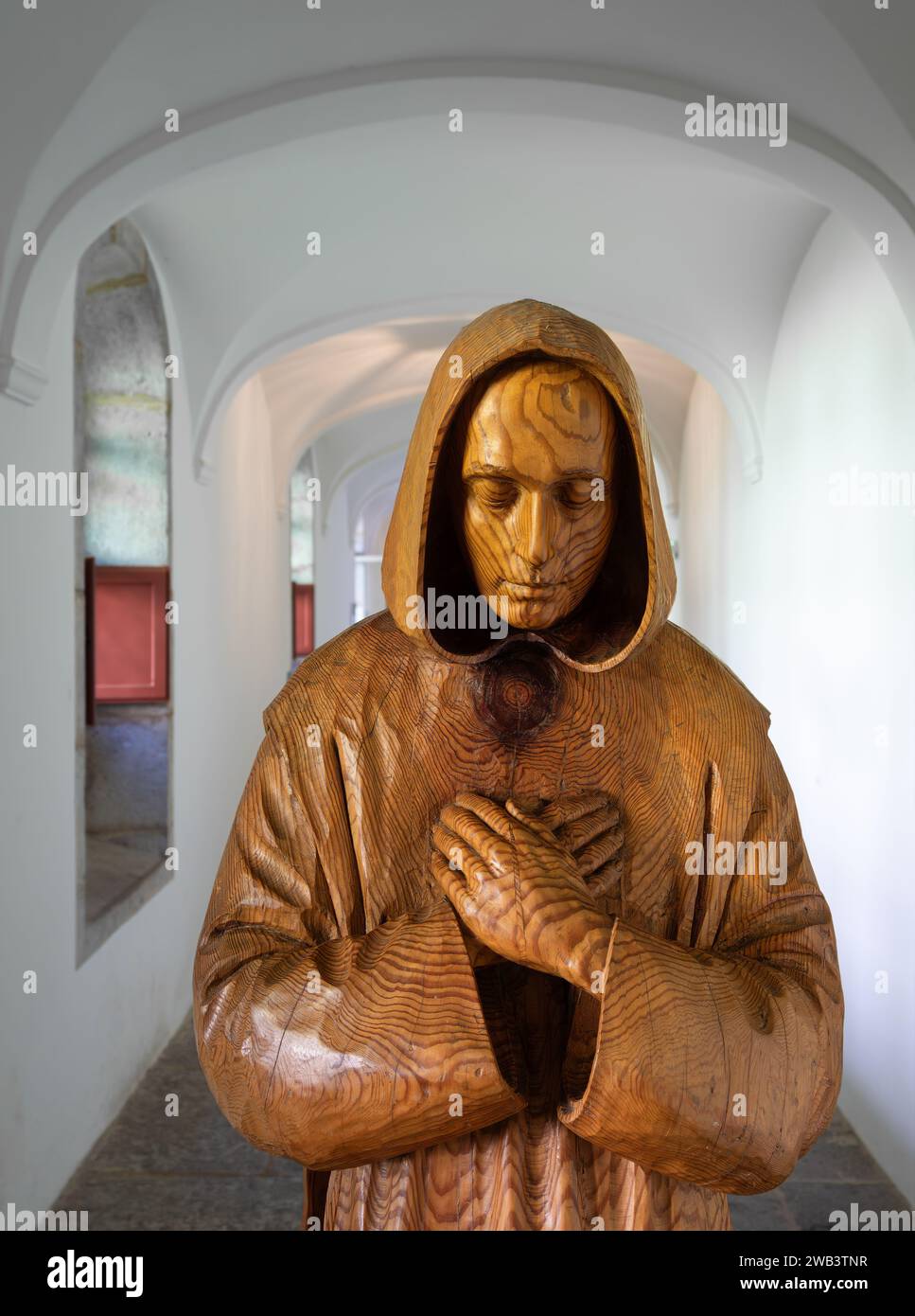 Grande Chartreuse, France - September 30, 2023: Corridor of the Grande Chartreuse Carthusian Museum with a sculpture of Saint Bruno, the founder of th Stock Photo