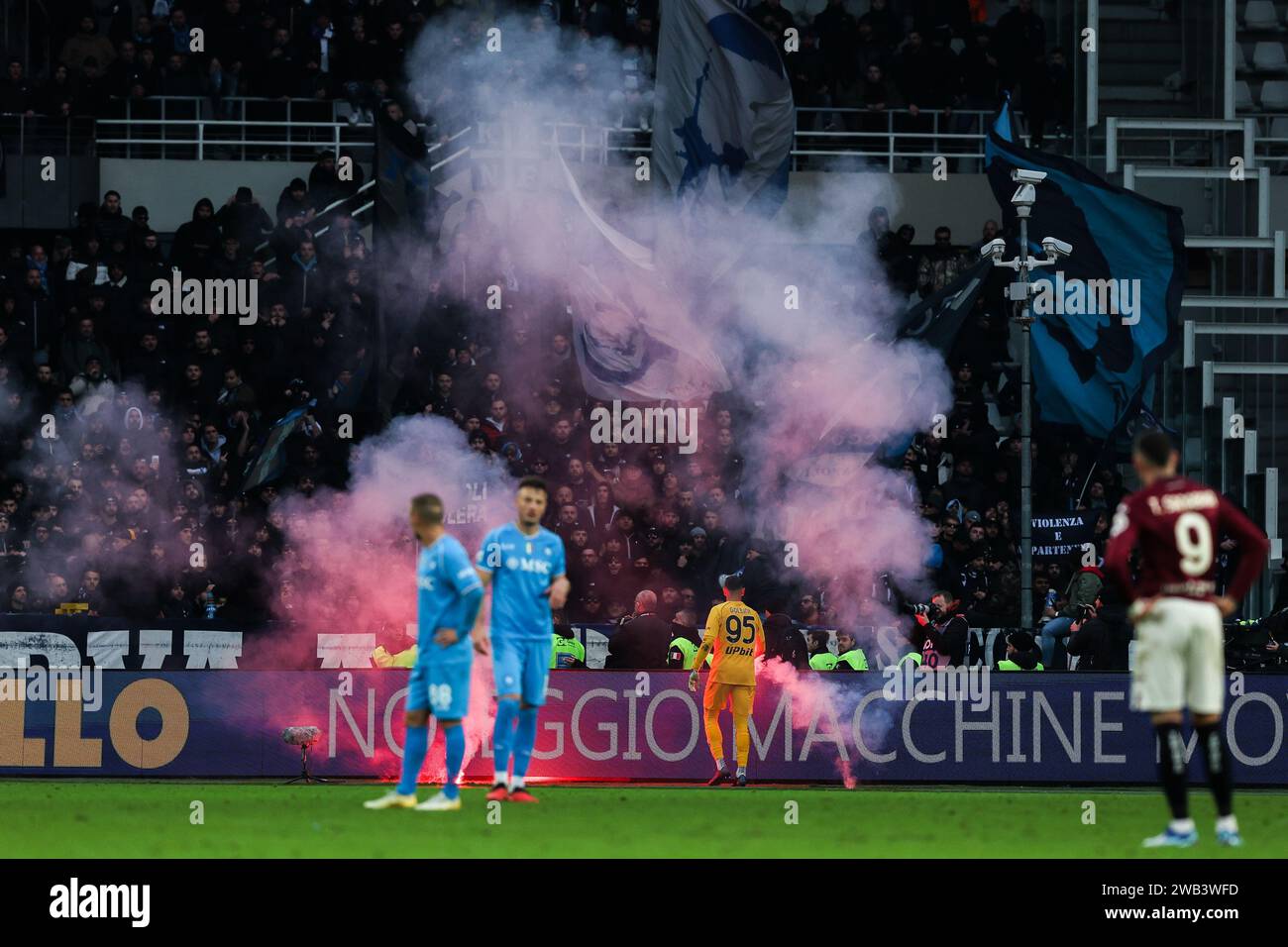 Turin, Italy. 07th Jan, 2024. SSC Napoli fans throw smoke bombs onto