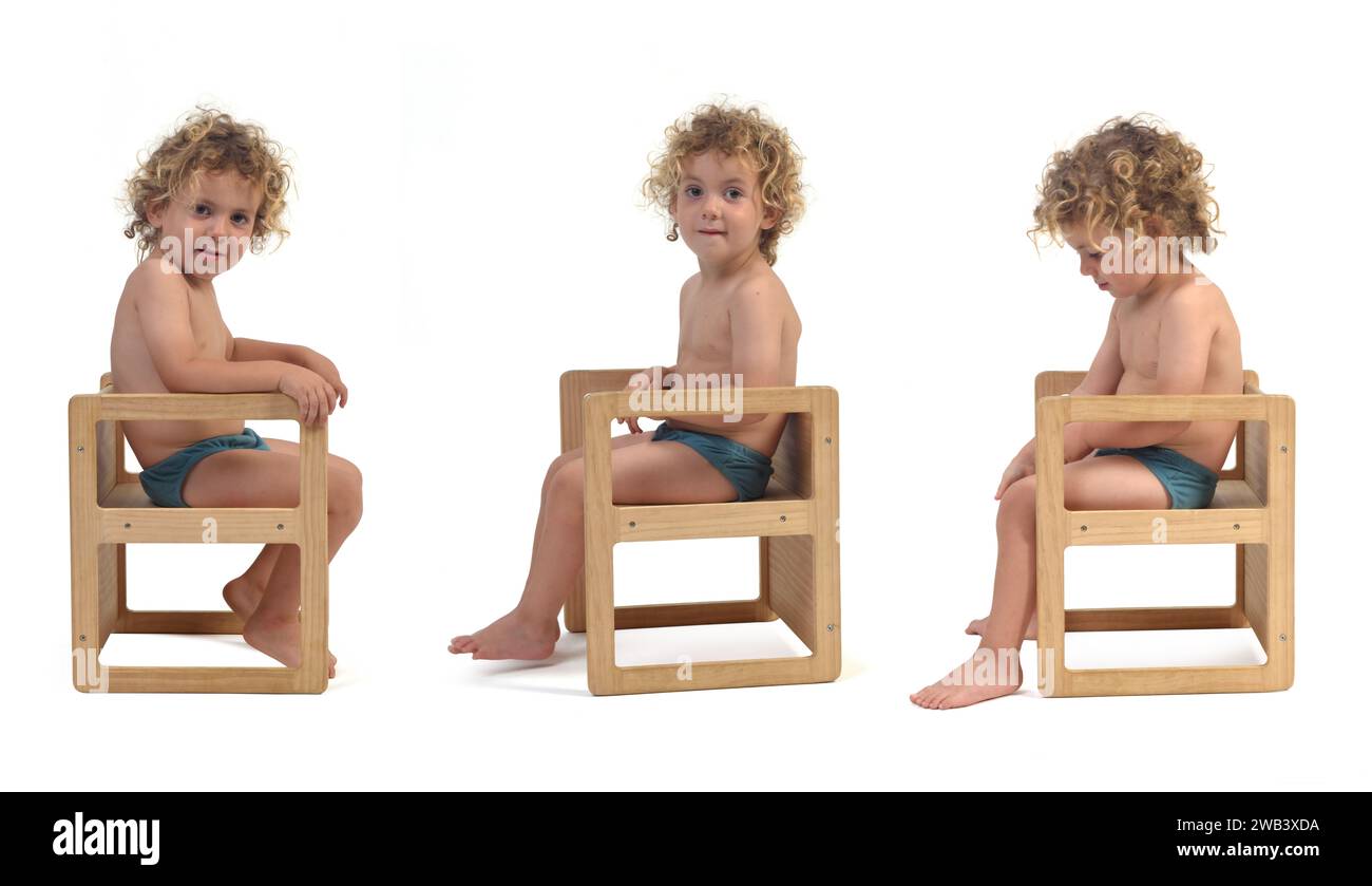 side view of a group of same boy in underpants sitting on chair on white background (3 year old) Stock Photo