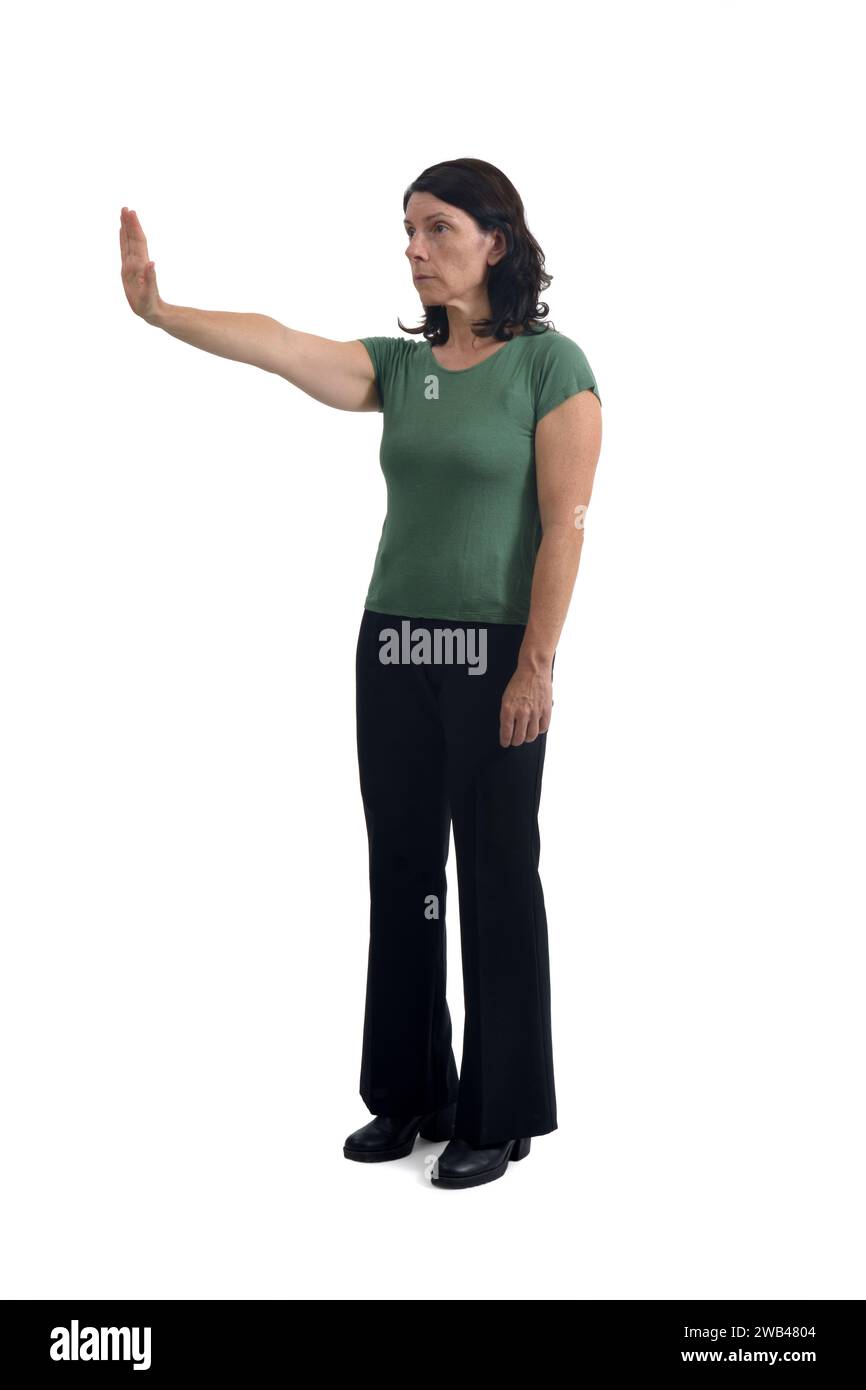 view of a woman showing the stop sign with their hands on white background Stock Photo