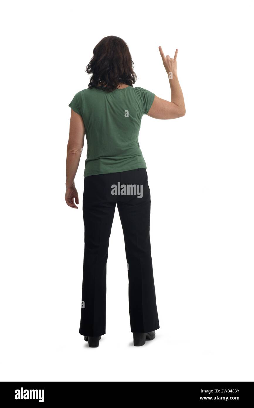 back view of a woman showing the horns sign with fingers on white