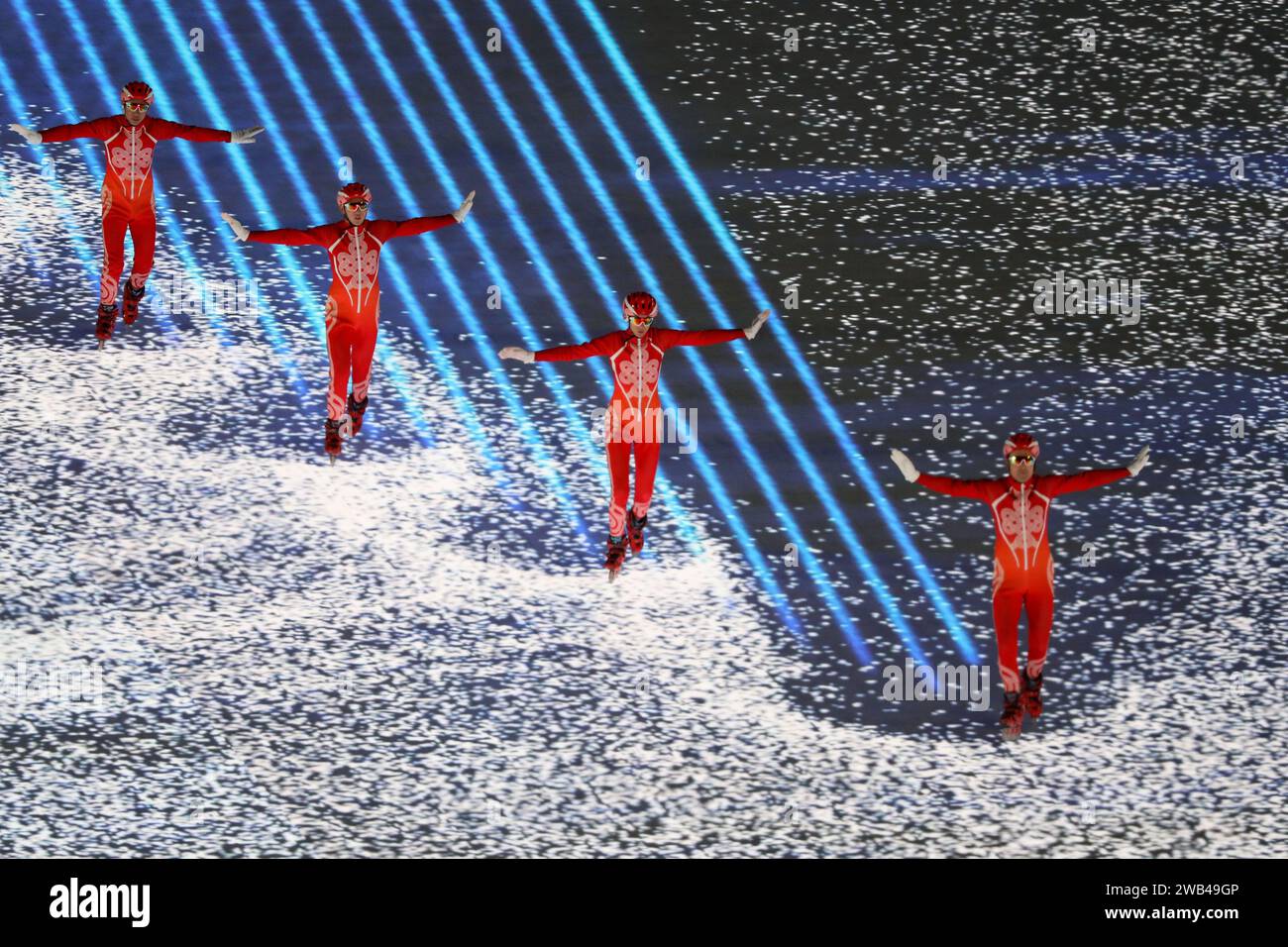 FEB 4, 2022 - Beijing, China: a group of ice skaters carve out paths on the LED floor during the Opening Ceremony of the Beijing 2022 Winter Olympic G Stock Photo