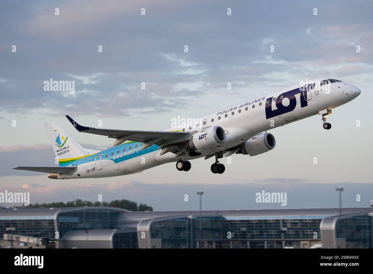 LOT Polish Airlines Embraer E195 wearing 'Warmia Mazury' livery taking off from Lviv Stock Photo