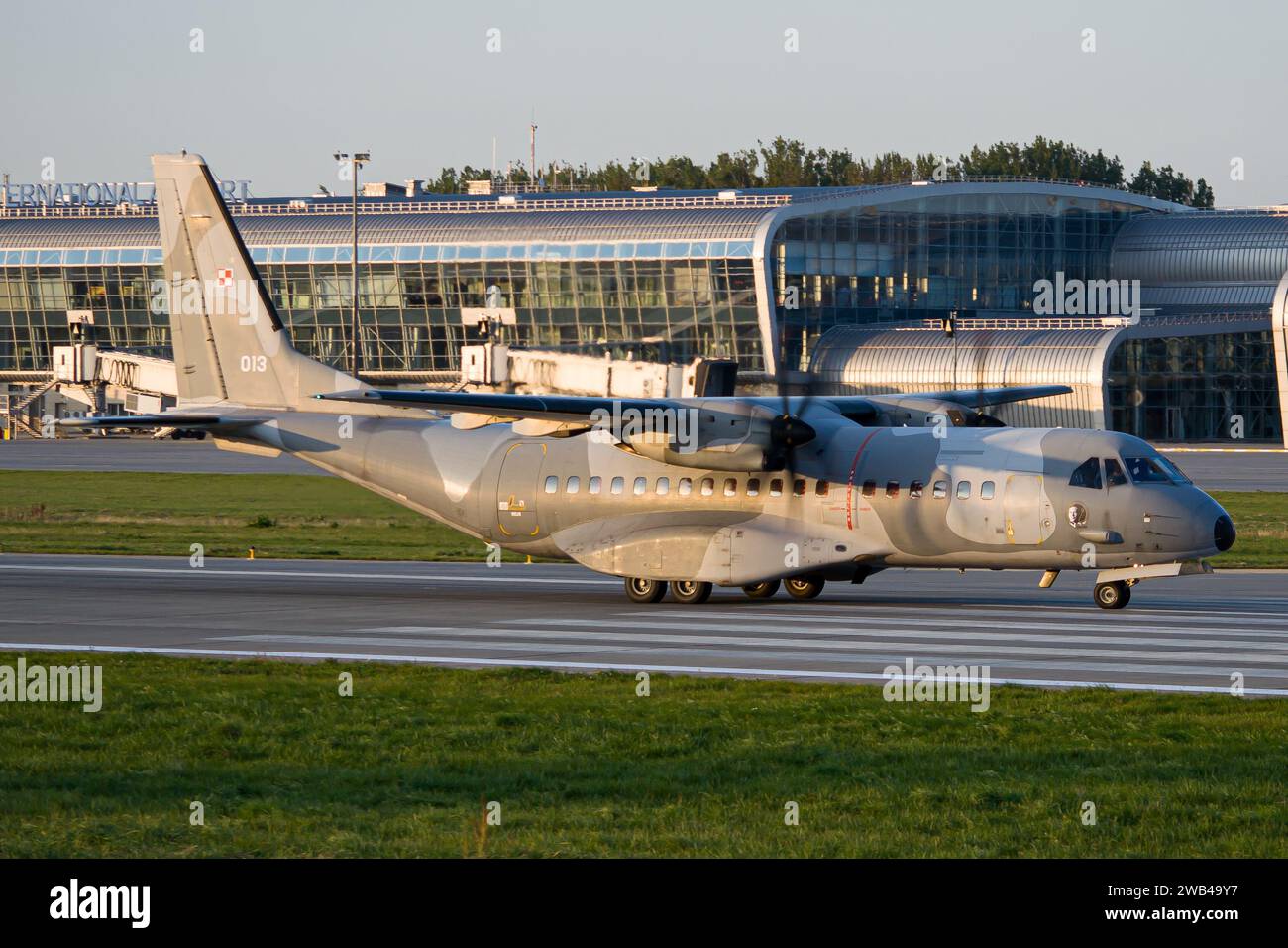 Polish Air Force CASA C-295M taxiing after landing in Lviv during golden hour Stock Photo