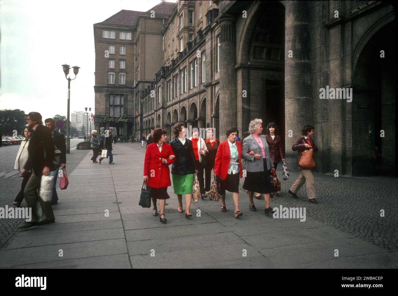 Passers-by near the Café Prag in Dresden, East Germany. 1982 Stock Photo