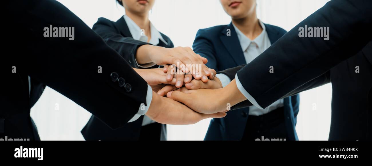 Office worker team stacking hand together symbolize successful group of ...