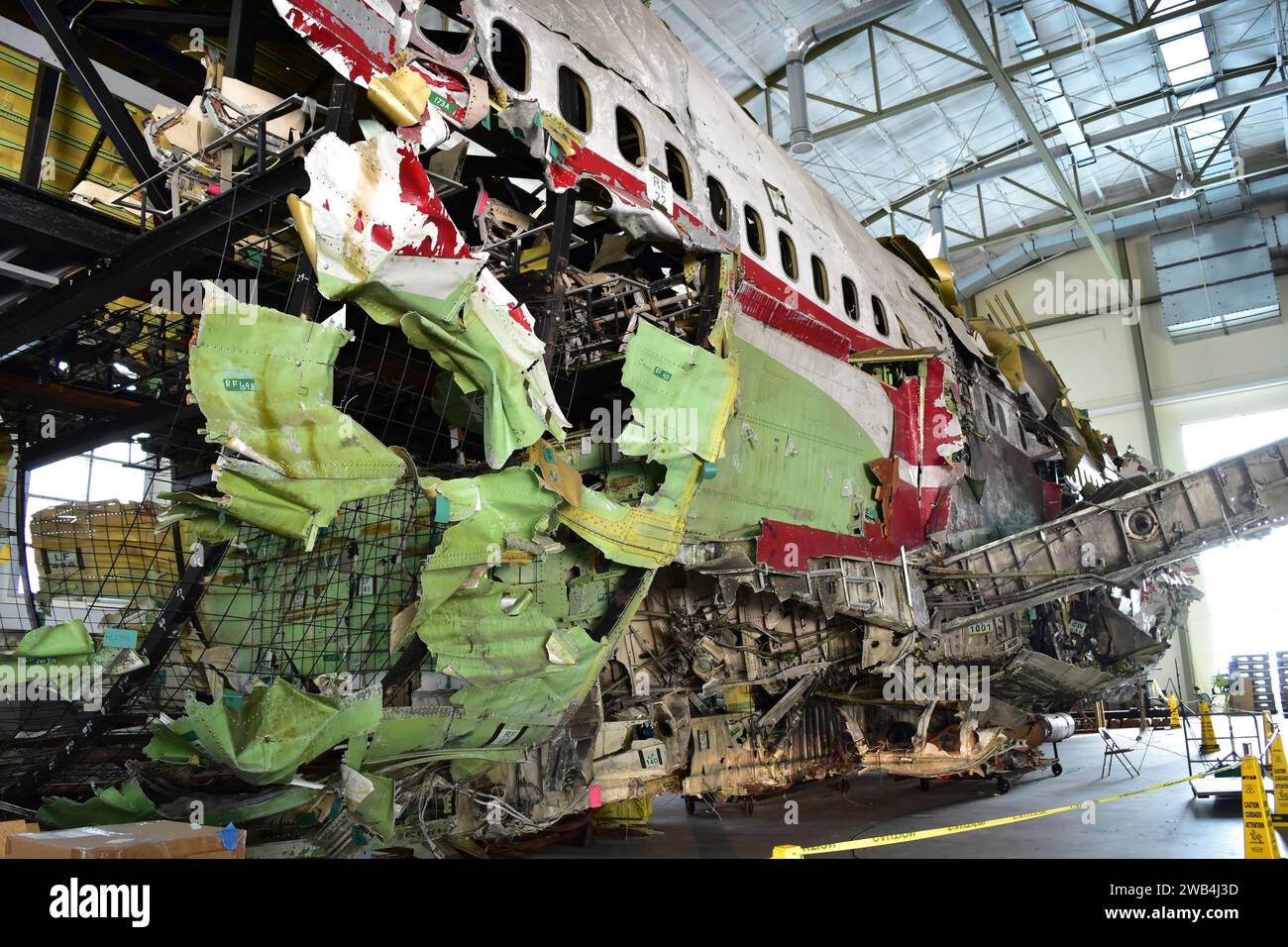 The U.S. National Transportation Safety Board reconstructs the wreckage of TWA Flight 800 at a hangar in Virginia. On July 17, 1996, about 2031 eastern daylight time, Trans World Airlines, Inc. (TWA) flight 800, a Boeing 747-131, N93119, crashed in the Atlantic Ocean near East Moriches, New York. TWA flight 800 was operating under the provisions of 14 Code of Federal Regulations Part 121 as a scheduled international passenger flight from John F. Kennedy International Airport (JFK), New York, New York, to Charles DeGaulle International Airport, Paris, France. Stock Photo