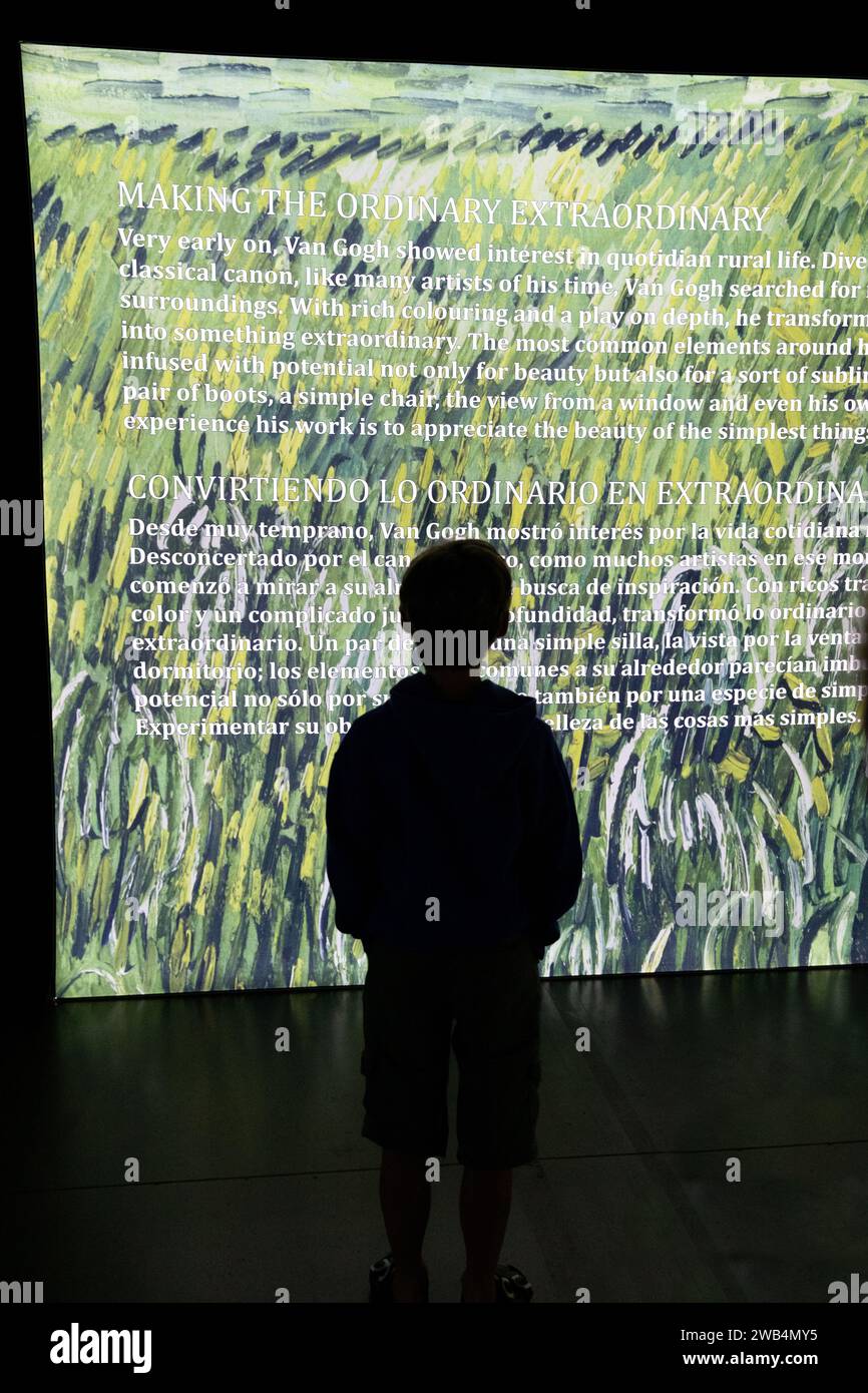 Child Viewing biography at the Beyond Van Gogh Immersive Experience in Regina Stock Photo