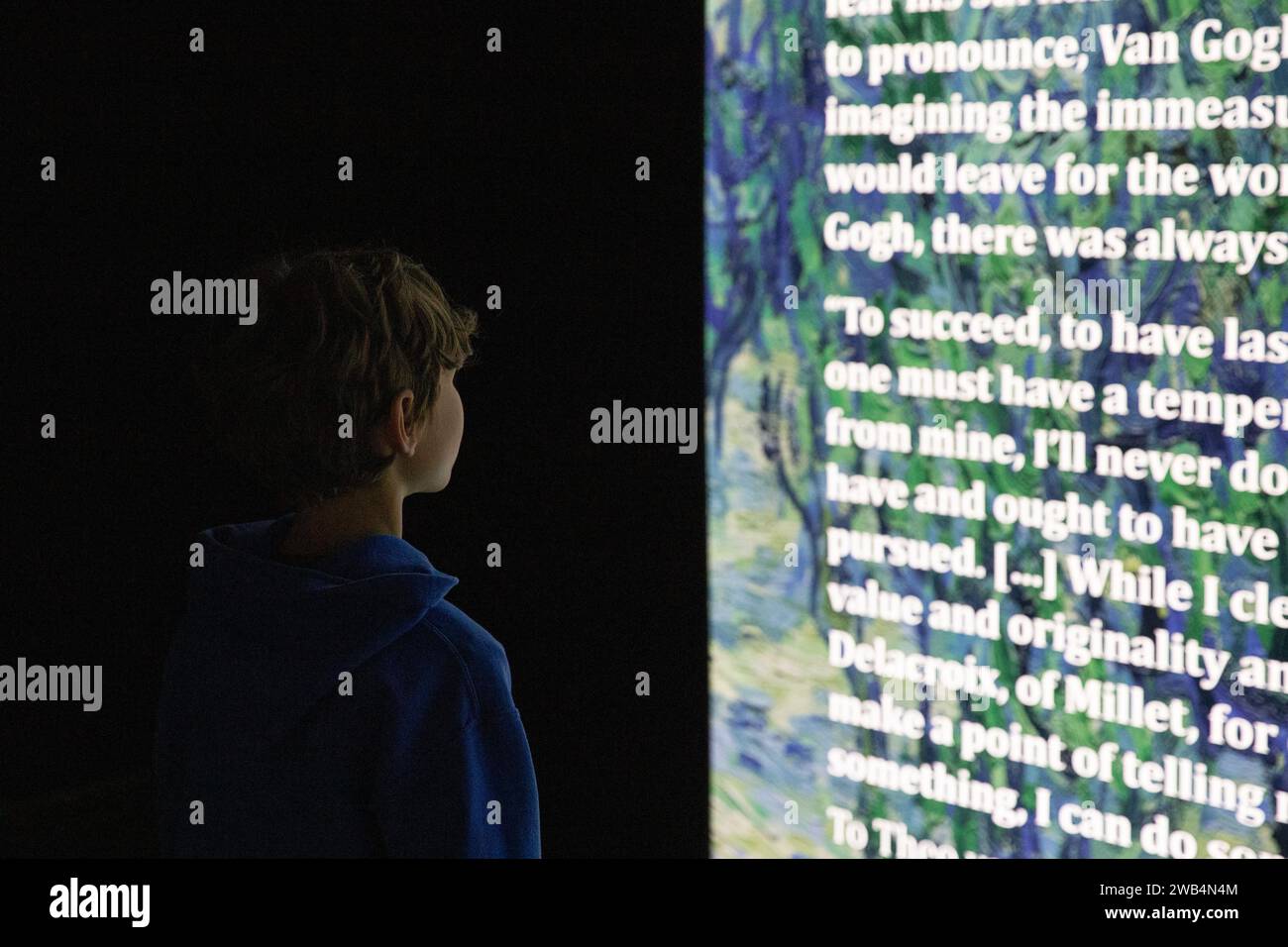 Boy viewing Beyond Van Gogh exhibit in Regina, Saskatchewan, Canada Stock Photo