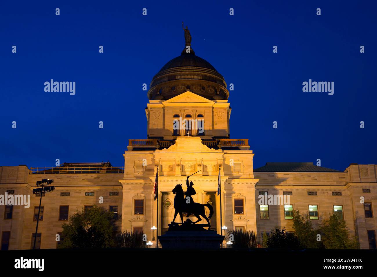 Thomas Francis Meagher statue with capitol at night, Montana State ...