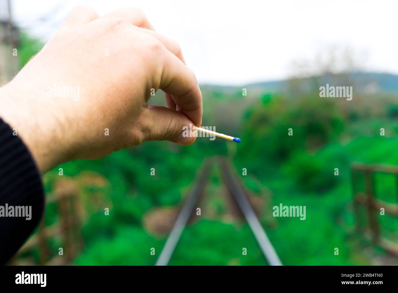 Matches on rails railroad tracks background, fire on railways concept
