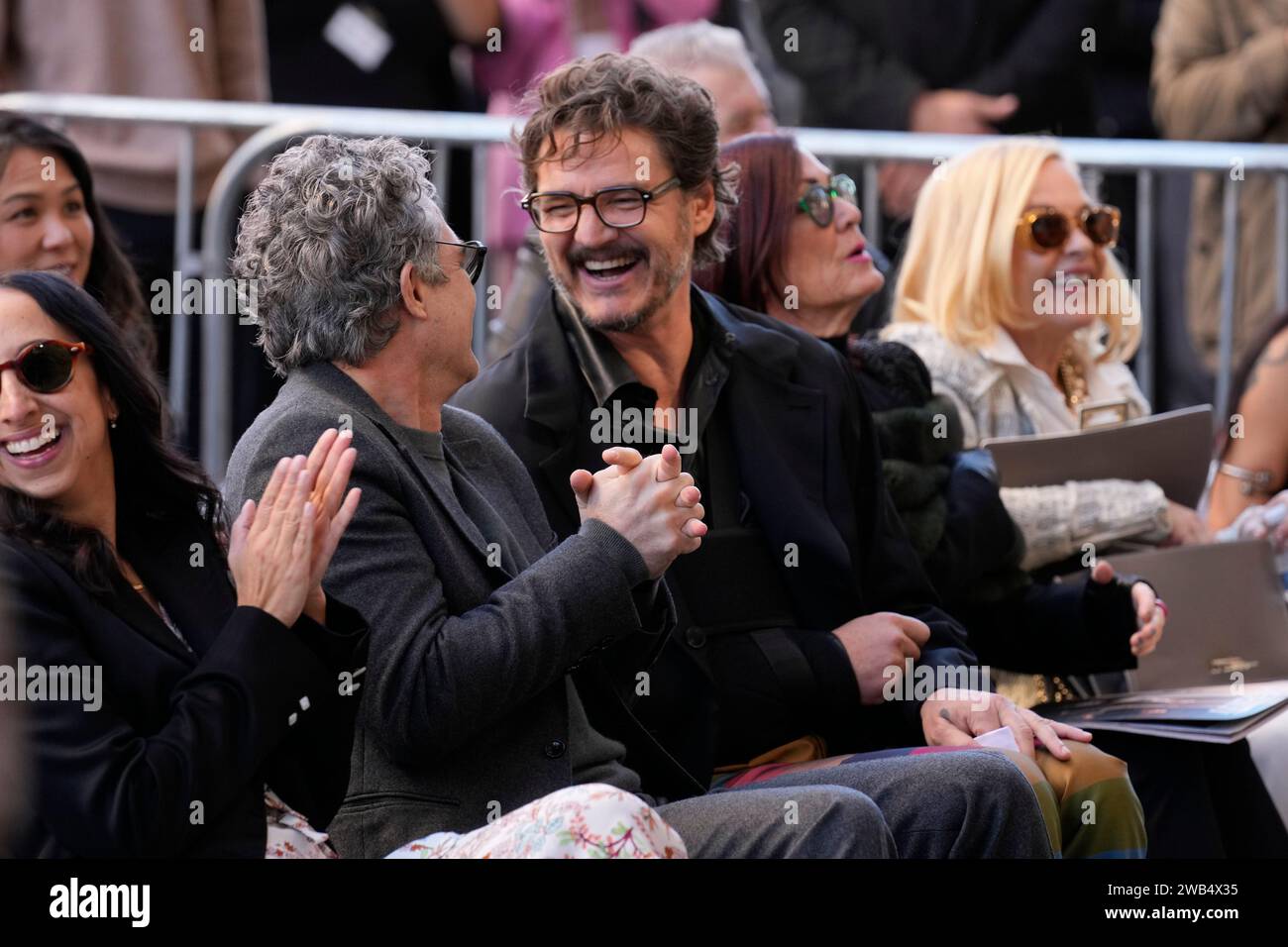 Pedro Pascal, center, laughs with Mark Ruffalo as they attend a ...