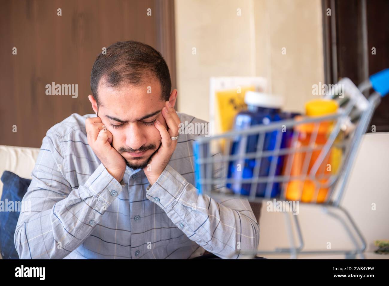 man holding bank card and medicine represent the costs of cure or treatment Stock Photo