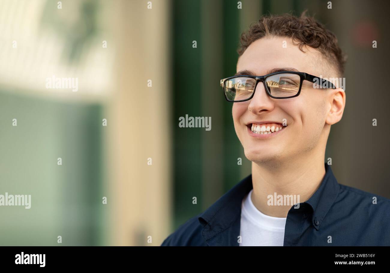 Man in glasses blue shirt hi-res stock photography and images - Alamy