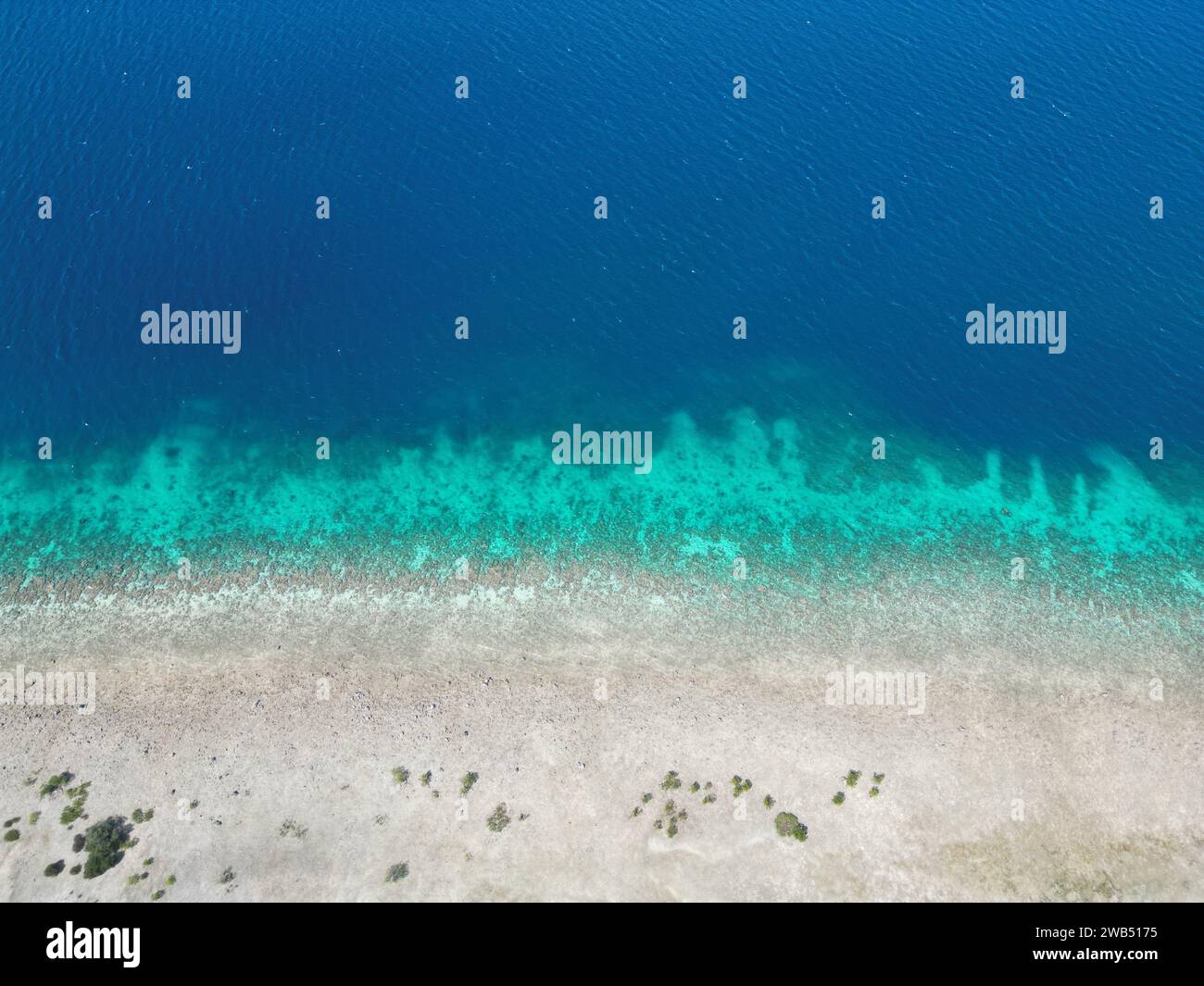 An aerial top view of a pristine sandy beach in Indonesia Stock Photo ...